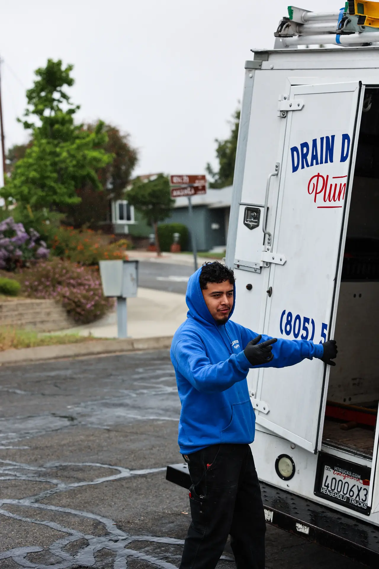 Drain Doctors Plumbing technician preparing equipment in San Luis Obispo, CA