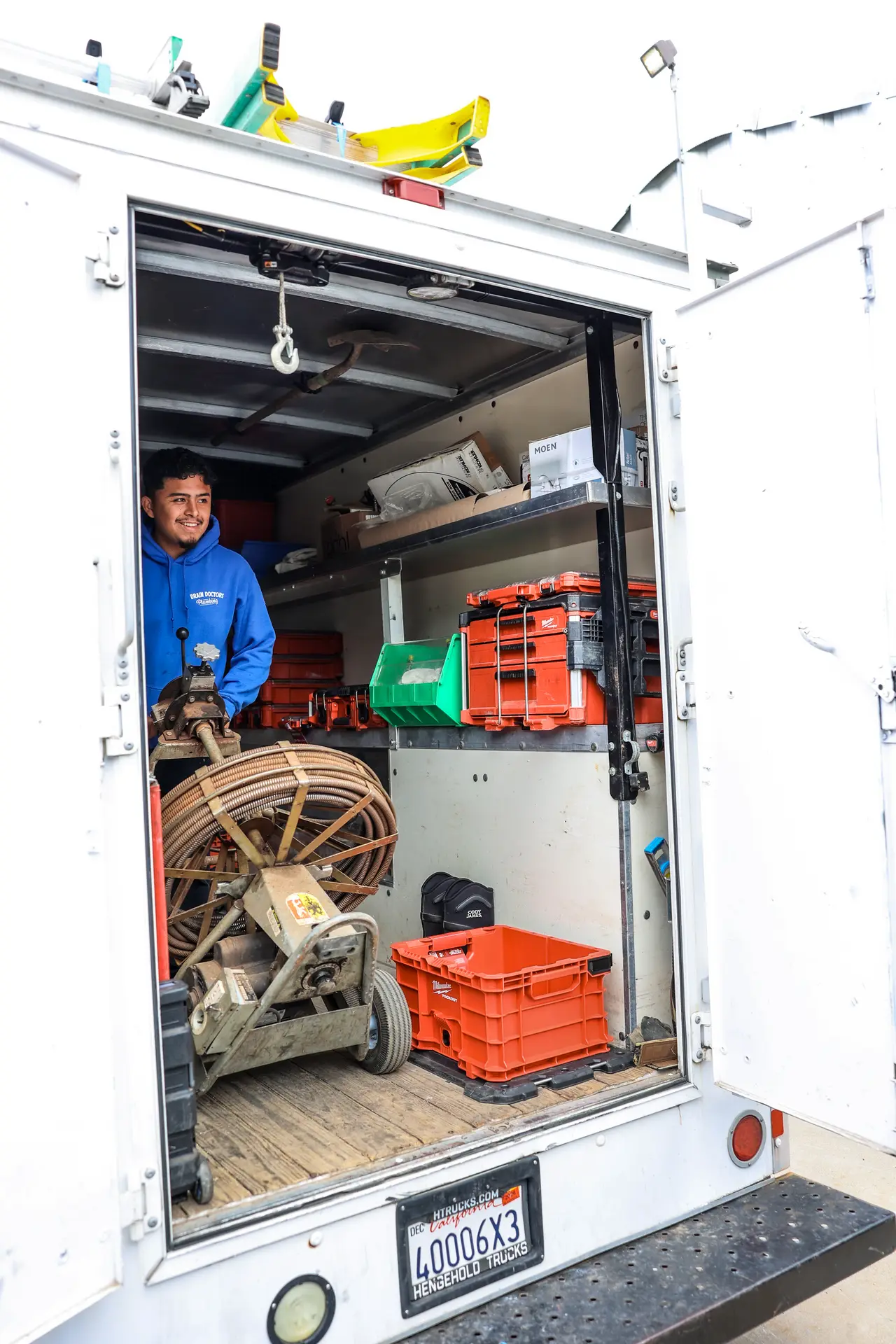Drain Doctors Plumbing technician preparing equipment in San Luis Obispo, CA