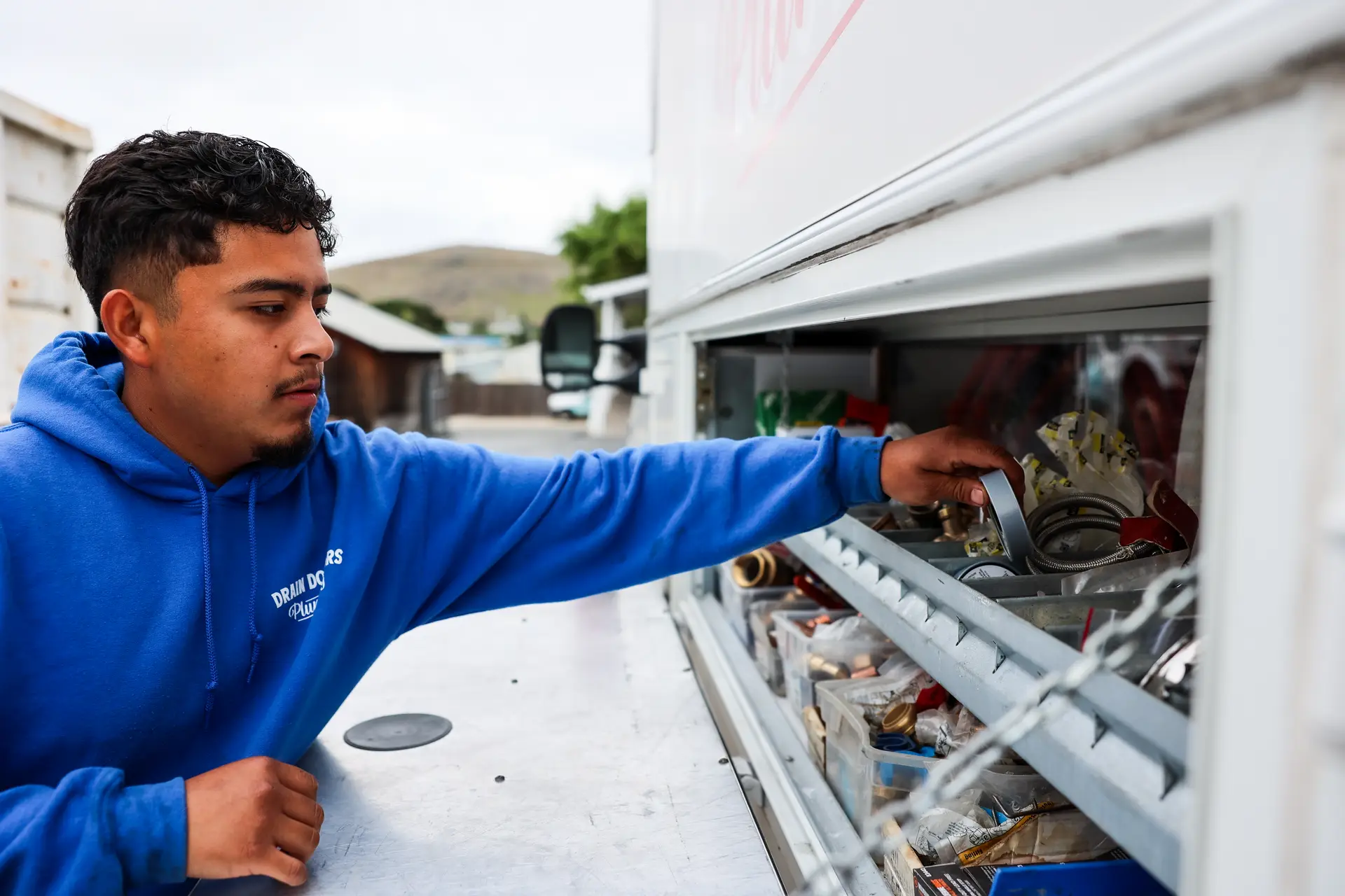 Drain Doctors Plumbing technician preparing equipment in San Luis Obispo, CA