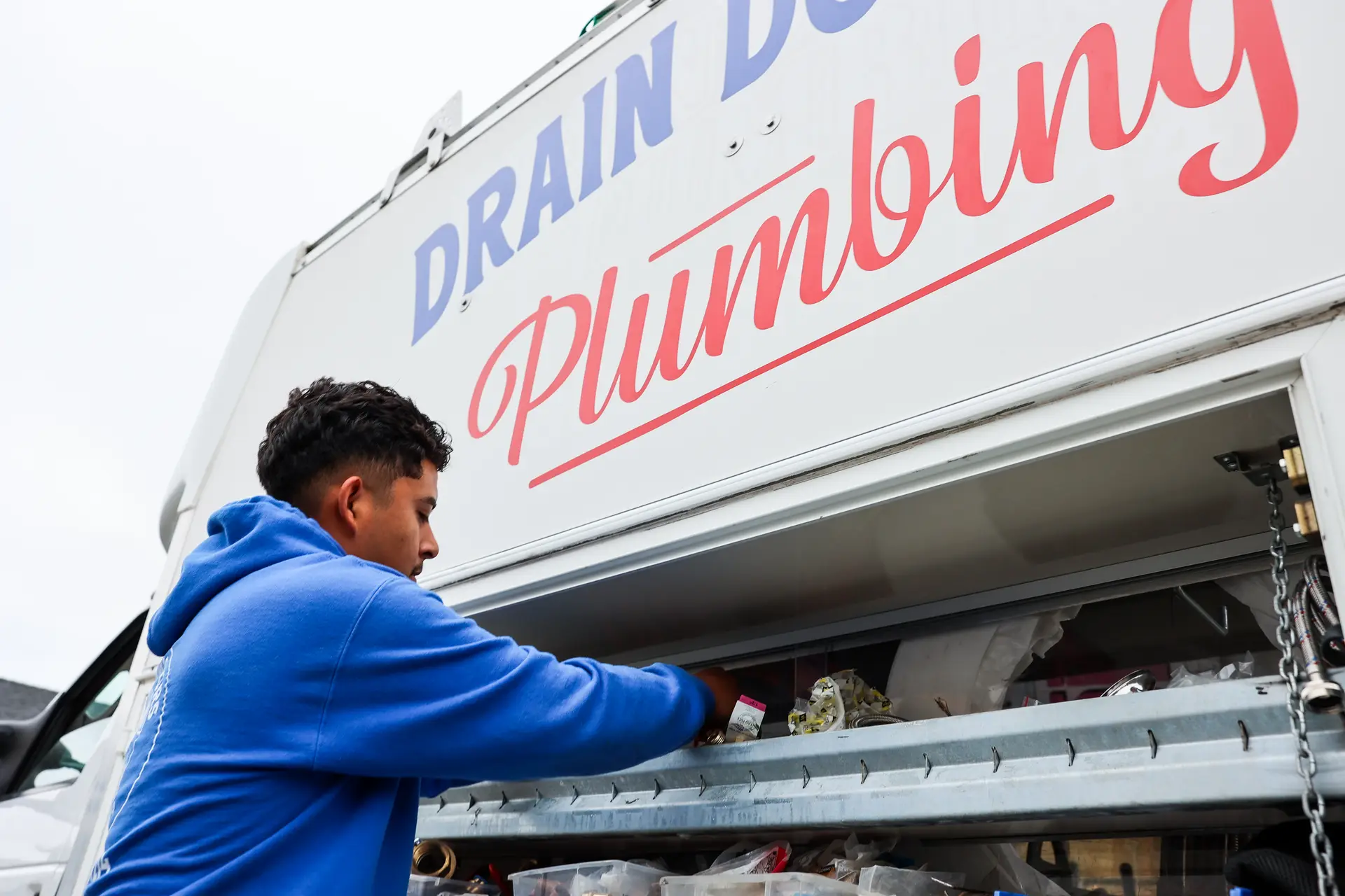 Drain Doctors Plumbing technician preparing equipment in San Luis Obispo, CA
